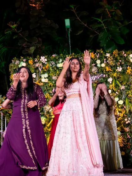 The bride's squad in action. I love the mix of colors in their outfits, which makes the group dance even more visually appealing.