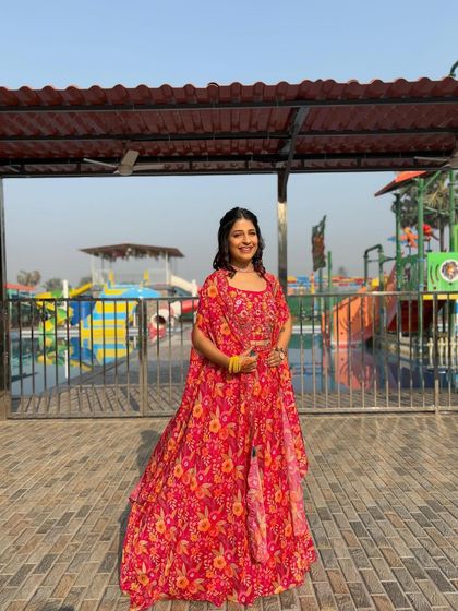 This full-length view shows how the floral cape set creates a cohesive and stylish look. It’s a fantastic rental option for anyone wanting a fresh, modern take on festive wear.