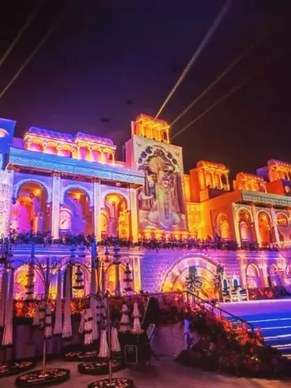 The full view of a grand palace facade with intricate projection mapping. This technique allows me to paint with light, highlighting architectural details and creating a truly spectacular show.