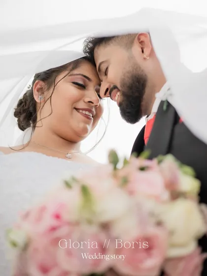 An intimate moment from a Christian wedding, captured under the bride's veil. I focus on creating soft, romantic portraits that highlight the couple's connection, using natural light to create a timeless feel.