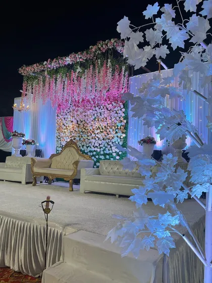 A wide shot of the pink and white wisteria stage, featuring a decorative white tree in the foreground. This shows how I use different elements to build a complete visual theme.
