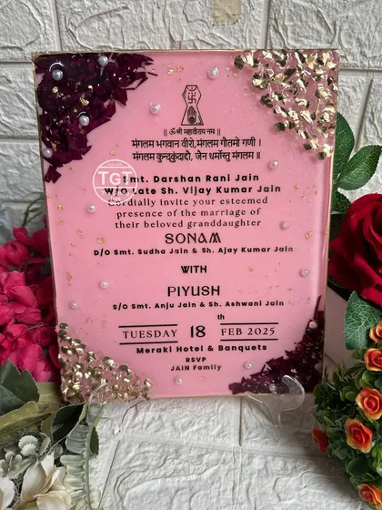 A clear, frontal view of the invitation, making the Hindi and English text easy to read.
