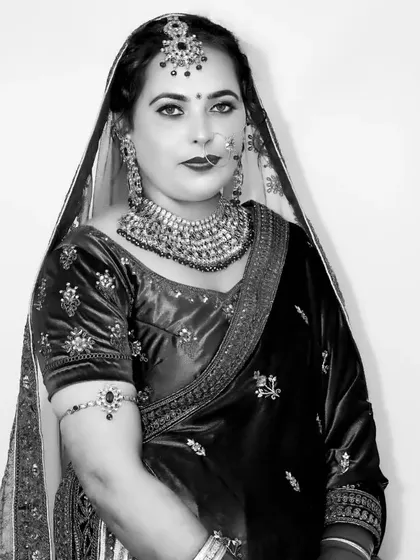 A simple and powerful black and white portrait, where the focus is entirely on the bride's expression.