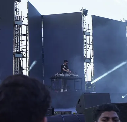 A throwback to one of my biggest shows, opening for major desi hip hop artists like Raftaar and Krsna. This shot shows the massive stage setup I'm comfortable performing on.