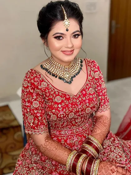 A lovely half-body shot of this bride. Her smile is so sweet, and the makeup is soft and natural.