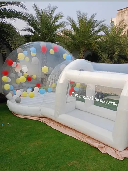 Our Bubble House and entrance tunnel set up on a lawn, ready to be filled with balloons and happy kids.