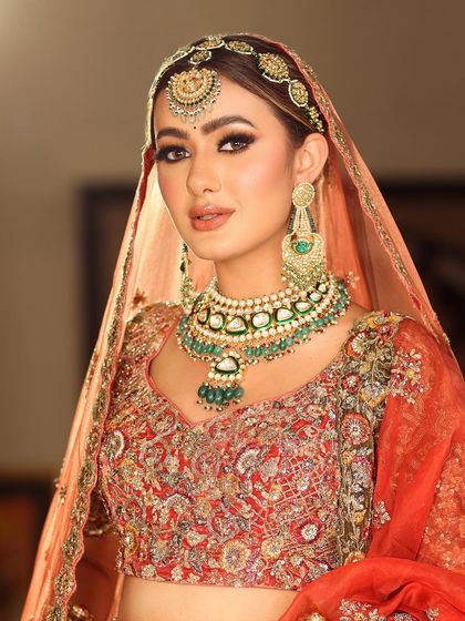 A classic bridal pose. The makeup is designed to look perfect from every angle, ensuring you are picture-perfect throughout your wedding day.