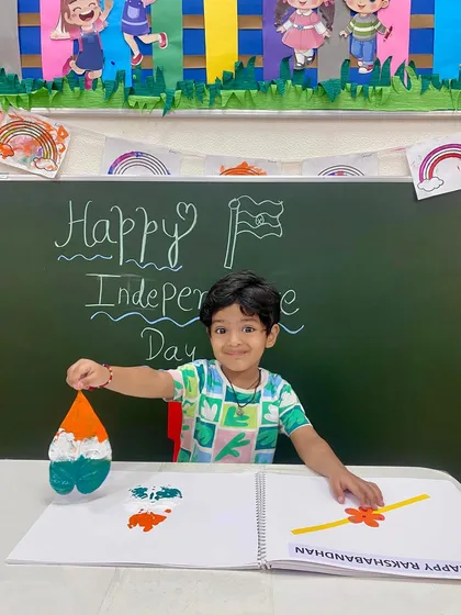 A proud smile and a beautifully finished craft. This young boy shows off his tri-colour creation, a result of our fun and educational Independence Day art session.