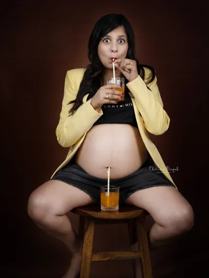 Maternity shoots should be fun and reflect your personality! We love getting creative with playful concepts like this "sipping for two" idea that brings out genuine smiles and laughter.
