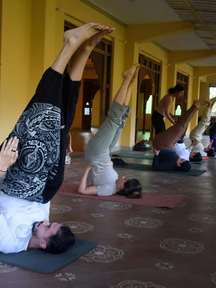 Inversions like this shoulder stand are a wonderful way to shift your perspective. Here, practitioners explore the pose at their own pace in our tranquil Dehradun shala.