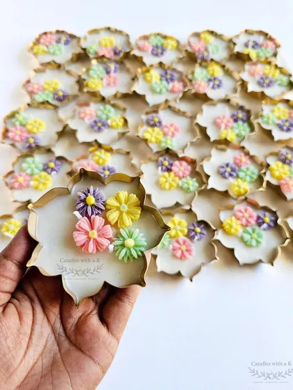 Iconic Urli Candles in Pastel. This is one of my most loved designs, a scented soy wax urli candle decorated with delicate, handmade mini daisy flowers. This particular piece, created for a client's brand, shows how we can adapt our popular designs to fit your unique aesthetic.