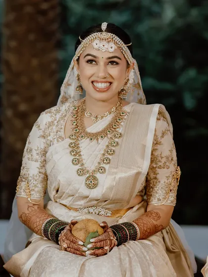 The pure joy of a Muhurtham ceremony. For this Telugu-Malayali bride, I crafted a look of subtle boldness and elegant radiance, with makeup that feels as light as air and lasts through every ritual.