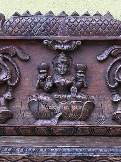 The central figure of GajaLakshmi from the 79-inch panel, flanked by elephants. The dark wood finish gives the piece a classic, stately appearance.