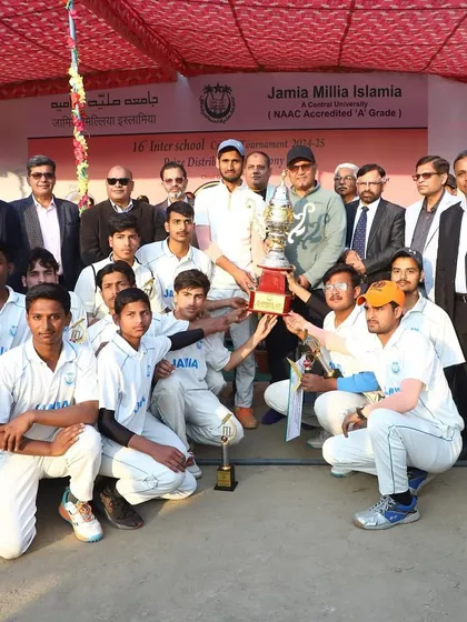 A moment of victory with a legend. The winning team of the Inter-School cricket tournament with Virender Sehwag. This is about celebrating success and learning from the best who have worn the Jamia colours.