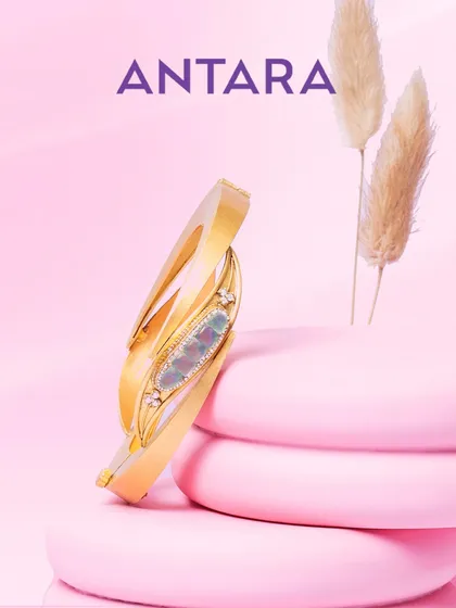 This 22KT brushed gold kada meets the deep allure of green tourmalines, redefining elegance from every angle. It's a piece that offers modern gold with an effortless edge.