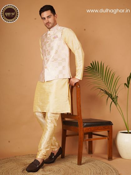 Elevate your festive look with this stunning cream kurta pajama and patterned Nehru jacket set.