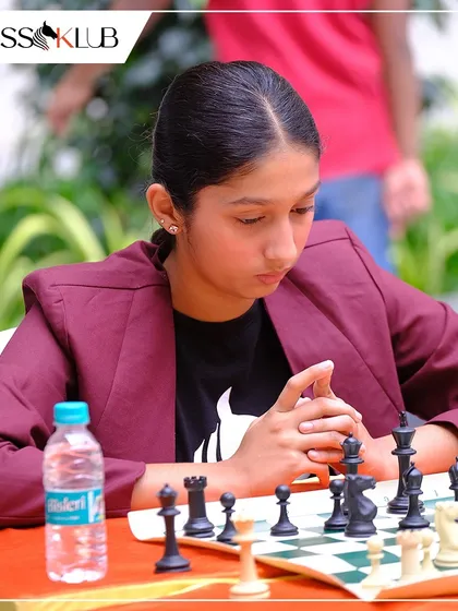 The deep concentration of a young competitor during a crucial match at the Chess Carnival. We create an environment that fosters strategic thinking and focus.
