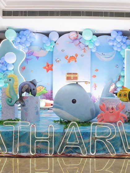 An elaborate underwater theme with 3D models of a whale, seahorse, and other sea life, creating an immersive ocean environment.