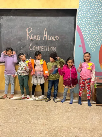 The whole group posing after a successful Read Aloud Competition. Every participant is a winner in our eyes.