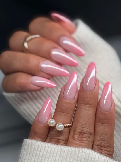 This angle shows the beautiful shine and flawless gradient of the pink ombre nails. It's a versatile look that works for any occasion, on any nail length.