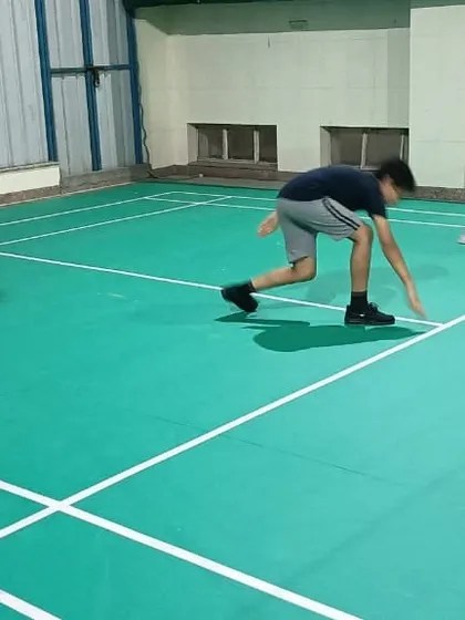 Agility and footwork are key in racket sports. Here, a student performs a speed drill on our synthetic badminton court to improve his on-court movement and reaction time.