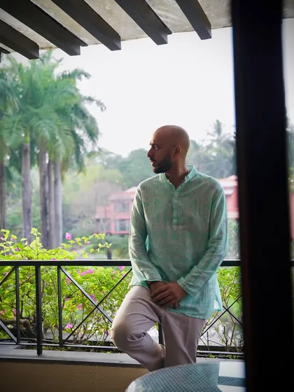 A moment of calm on the balcony in Goa, India. Taking in the tropical scenery before a big night of DJing.