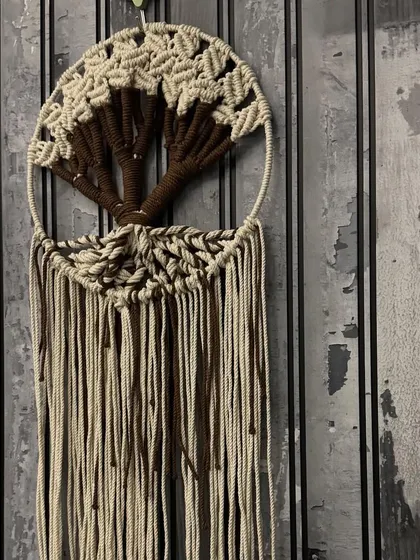 The Tree of Life is such a powerful symbol, and I enjoy weaving that meaning into my art. This macrame dream catcher features an intricate tree design, handcrafted with natural cotton cords to bring a sense of peace and connection to your space.