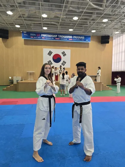 With a fellow black belt from another nation at the 2024 WT Partnership Taekwondo Program. The global community of Taekwondo is strong.