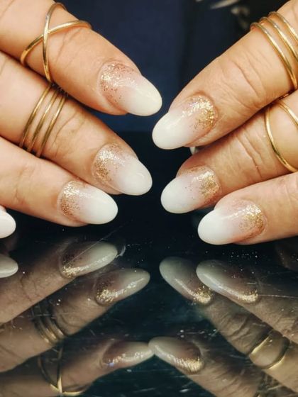 A beautiful baby boomer ombre with a touch of gold glitter sprinkled over the tips for extra sparkle.