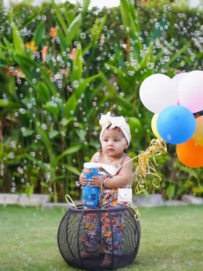 Bubbles and balloons make for the perfect candid shot. The pure delight on this little one's face is what candid photography is all about.