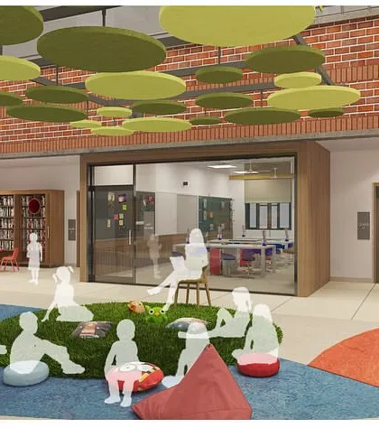 This concept image shows a central gathering space with varied seating options, including beanbags on a green carpet. The design encourages informal learning and social interaction in a comfortable, open setting.