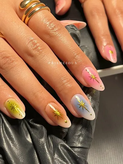 Holding the aura nail set, you can see how the colors complement each other to create a cohesive yet unique look across all ten fingers.