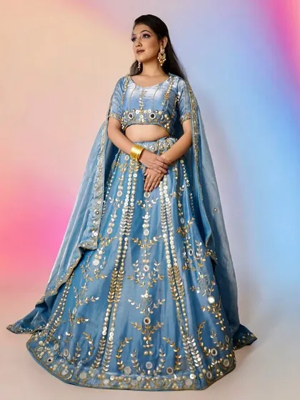 The full view of this stunning blue lehenga. The makeup is designed to stand out against a colorful background, making it ideal for sangeet nights or reception parties where you want to make a statement.