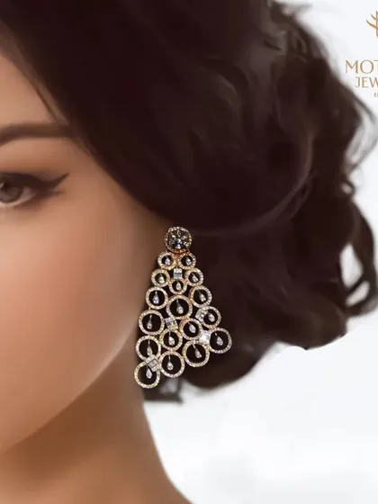 A model wears a pair of dramatic, cascading chandelier earrings made of black and white diamonds, a true statement of evening glamour.