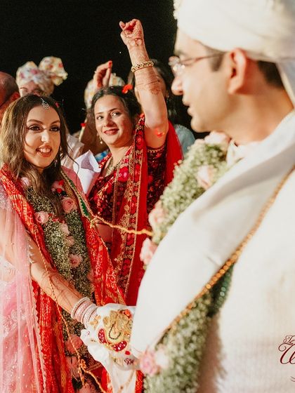 A playful moment during the ceremony, showcasing the fun and lightheartedness of the couple.