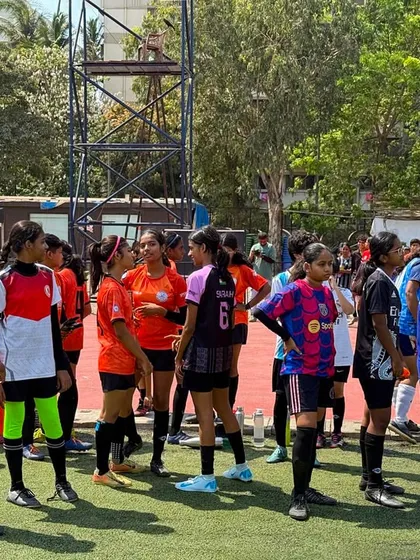 A group of young players listening intently during a break in the trials. The energy and focus were inspiring.