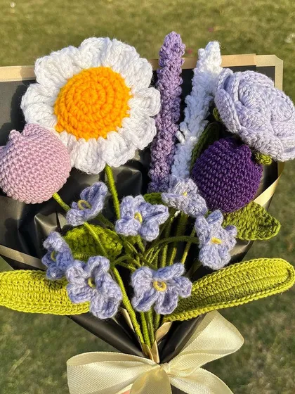 Which one would you pick? A beautiful, full bouquet featuring a large daisy, tulips, a rose, and lavender stems in a lovely purple and white color scheme.