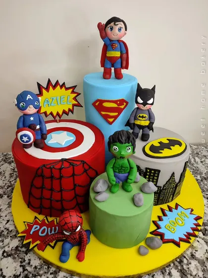 Avengers, assemble! This multi-cake setup brings together the mightiest heroes for an epic birthday. Each cake represents a different Avenger, from Captain America's shield and Spider-Man's web to Batman's Gotham and Hulk's smash, all topped with cute, chibi-style hero figurines.