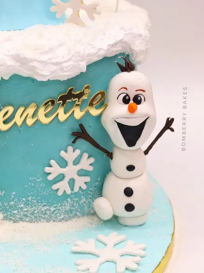 A detailed shot of the cheerful, hand-sculpted Olaf figurine.