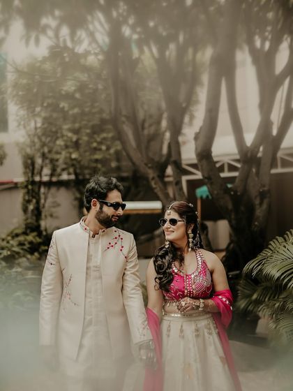 A hazy, dreamlike portrait of the couple. I used a creative foreground blur to give this image a soft, romantic feel, as if we're peeking into a private, magical moment.