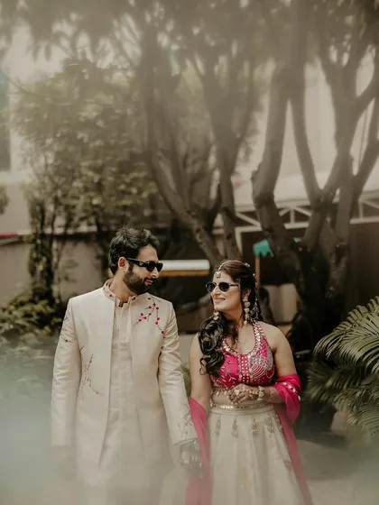 A hazy, dreamlike portrait of the couple. I used a creative foreground blur to give this image a soft, romantic feel, as if we're peeking into a private, magical moment.