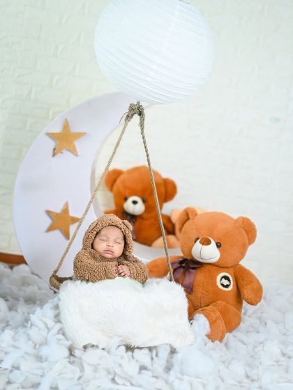 A teddy bear hot air balloon adventure! This creative setup uses props to tell a story and create a unique and memorable photo.