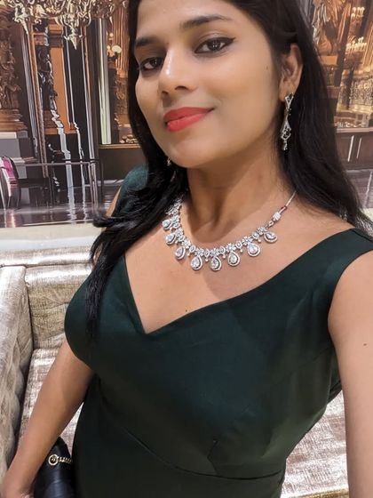 A simple and chic bottle green body-fit mermaid dress. This classic silhouette is perfect for a formal dinner or cocktail event.