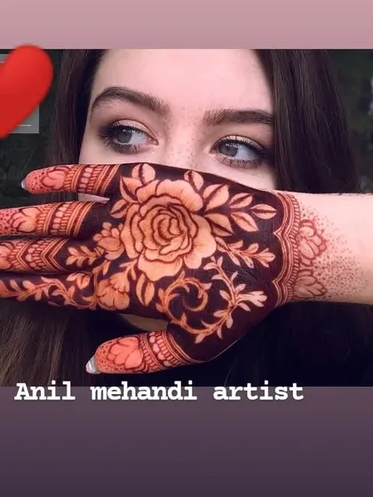 A bold and beautiful rose design covering the back of the hand. This style is very popular and creates a stunning visual, especially after the henna stain matures.