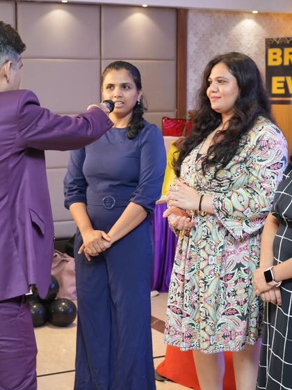 Engaging with a group of attendees on stage. Audience participation is a great way to make a large event feel more interactive and personal.