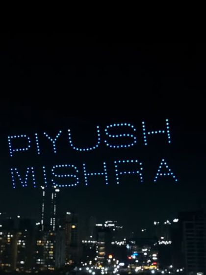 A tribute to the artist himself, with 'Piyush Mishra' spelled out in the sky. This formation was a highlight of our show for the Ballimaaraan concert, honoring the man behind the music.