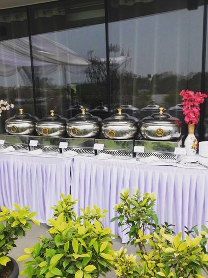 The full buffet line for the Sudha Carpets lunch. The setup is clean, professional, and inviting for the 50 guests.