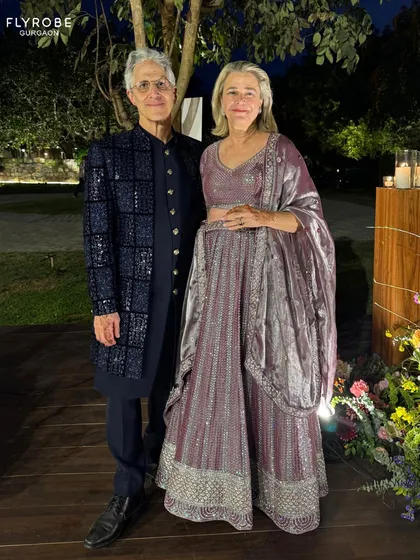 Style on demand. This international couple looks chic and elegant in their rented ethnic wear, proving that style is universal.