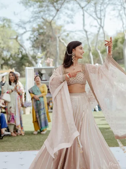 Another shot of the bride dancing, her joy evident. The simple hair and makeup allow for easy movement.