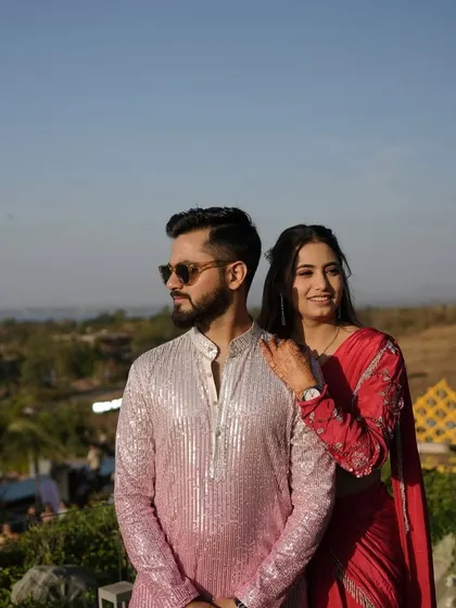 A stylish couple enjoying the view at their destination wedding. We help plan celebrations in locations that offer breathtaking backdrops.